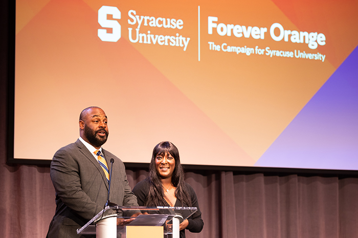 Our hosts, Life Trustee Donovan McNabb ’98 and Trustee Roxi McNabb ’98, G’99 welcome guests displayed in a new window